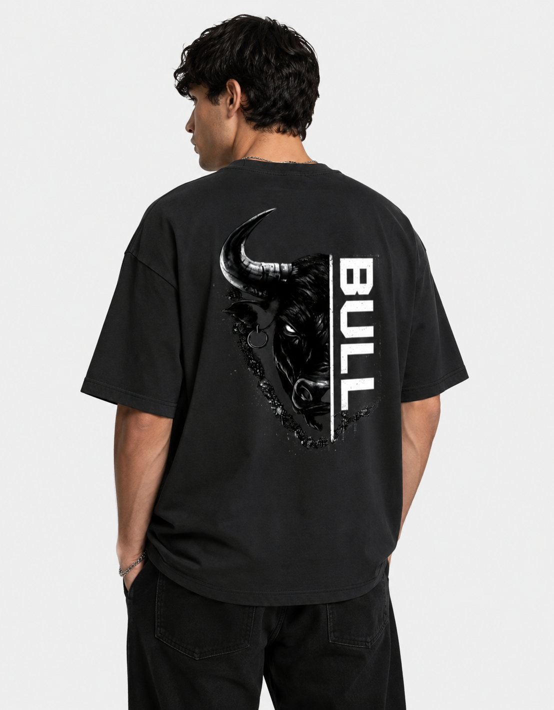 Person wearing a black t-shirt with a bull graphic and 'BULL' text on the back.