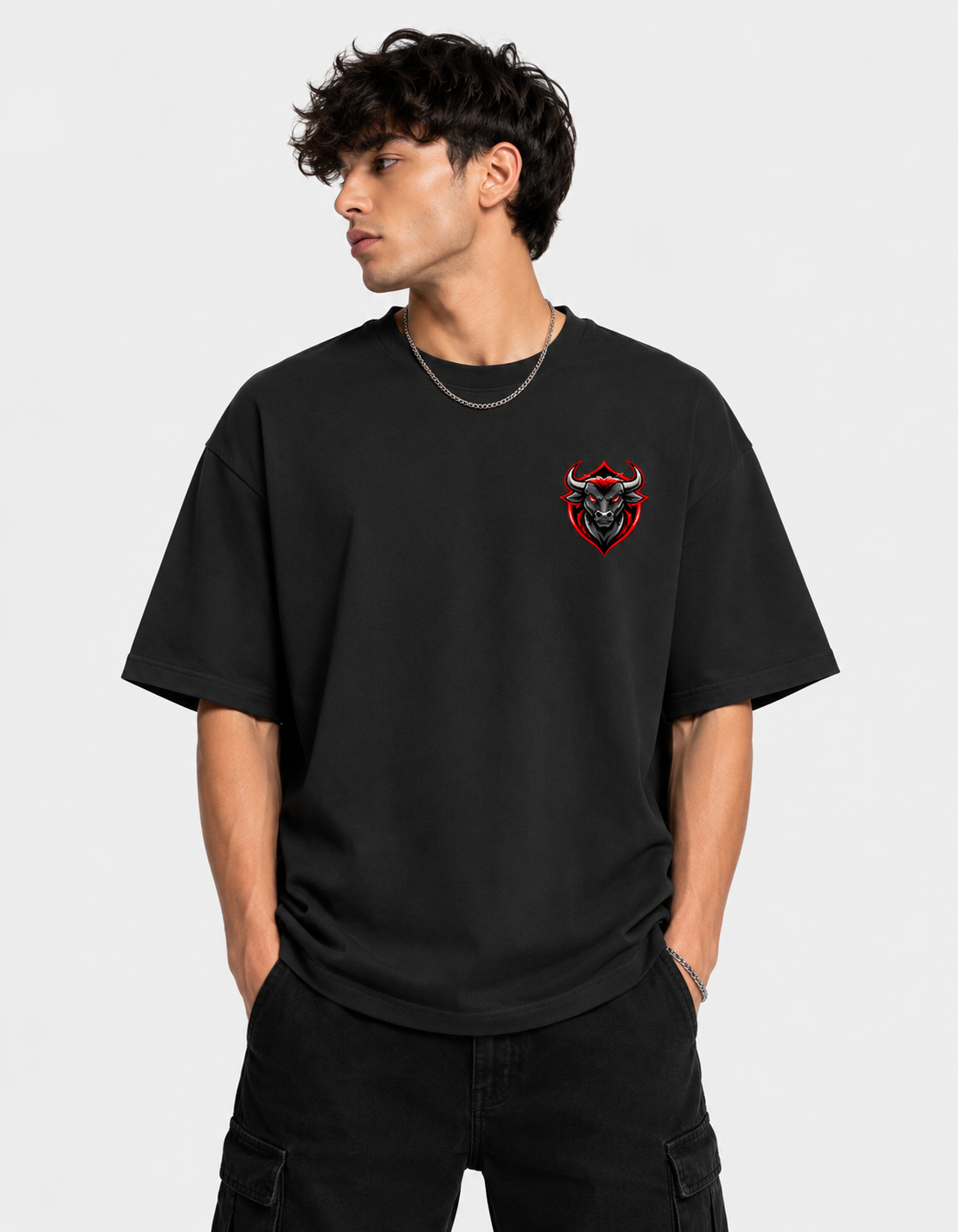 Person wearing a black t-shirt with a red and black logo on a light gray background