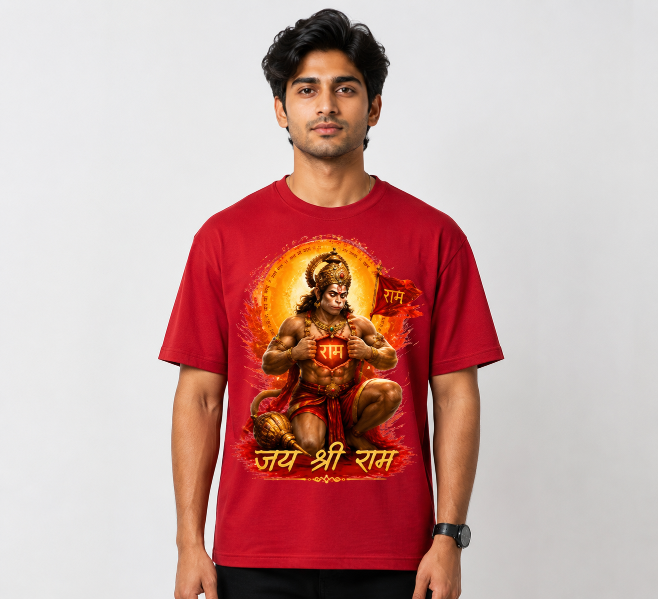 Person wearing a red t-shirt with a graphic design on a plain background