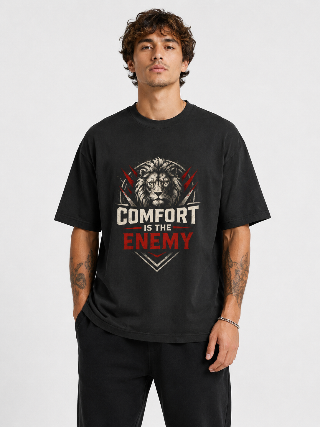 Person wearing a black t-shirt with a lion graphic and text on a white background