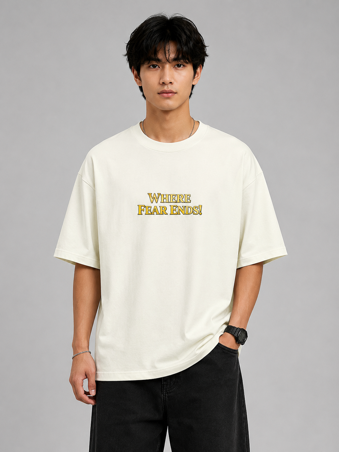 Person wearing a white t-shirt with yellow text on a gray background