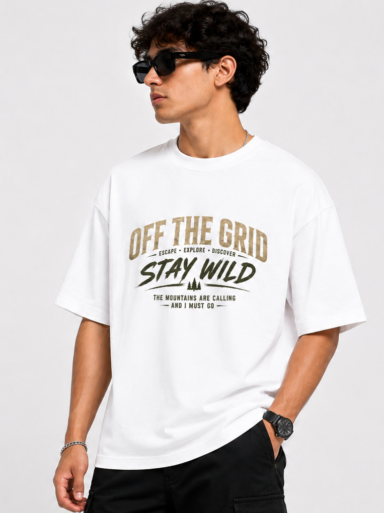 Person wearing a white t-shirt with 'Off The Grid Stay Wild' text on a plain background