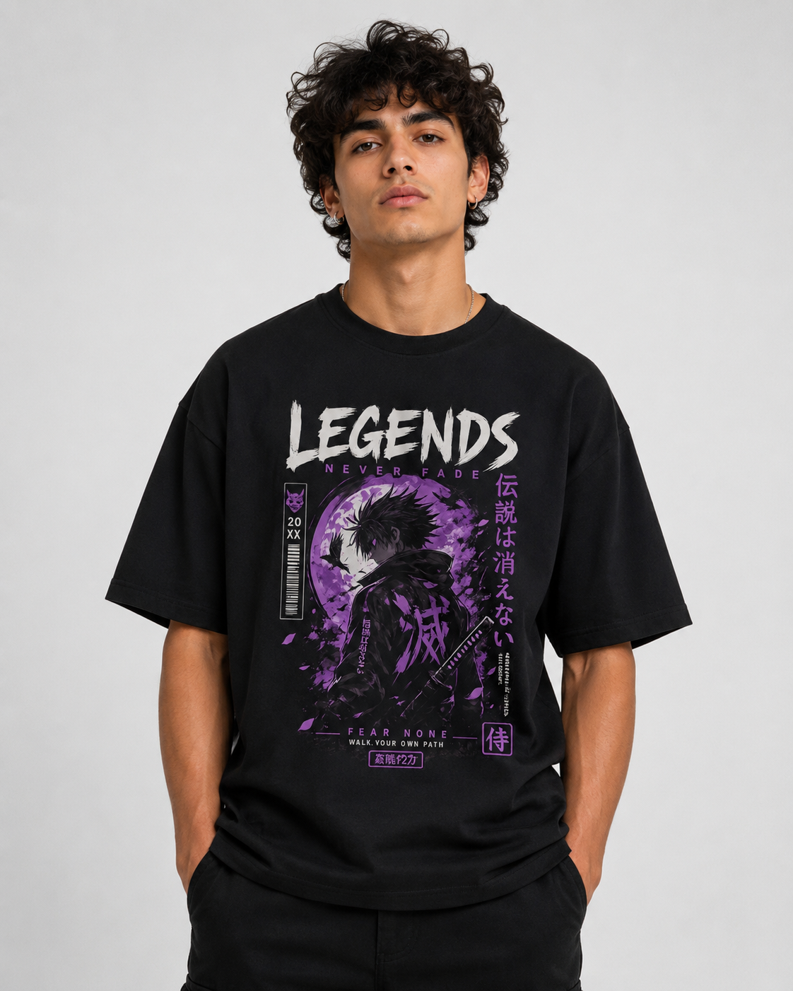 Person wearing a black t-shirt with 'Legends' graphic design on a plain background