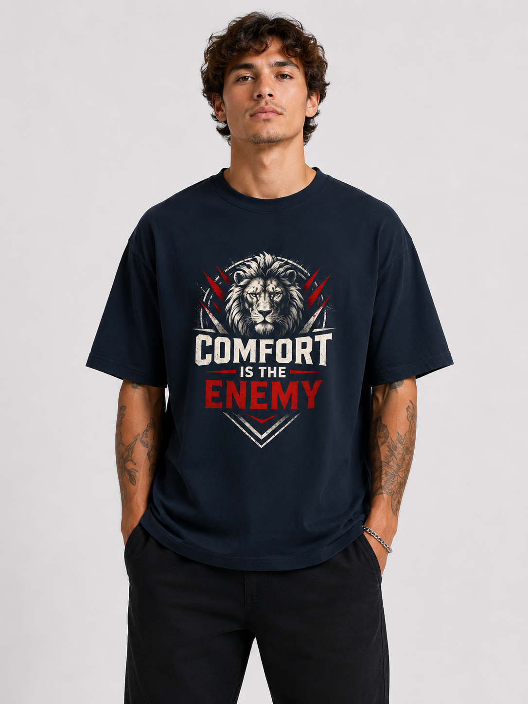 Person wearing a black t-shirt with a graphic design and text on a gray background