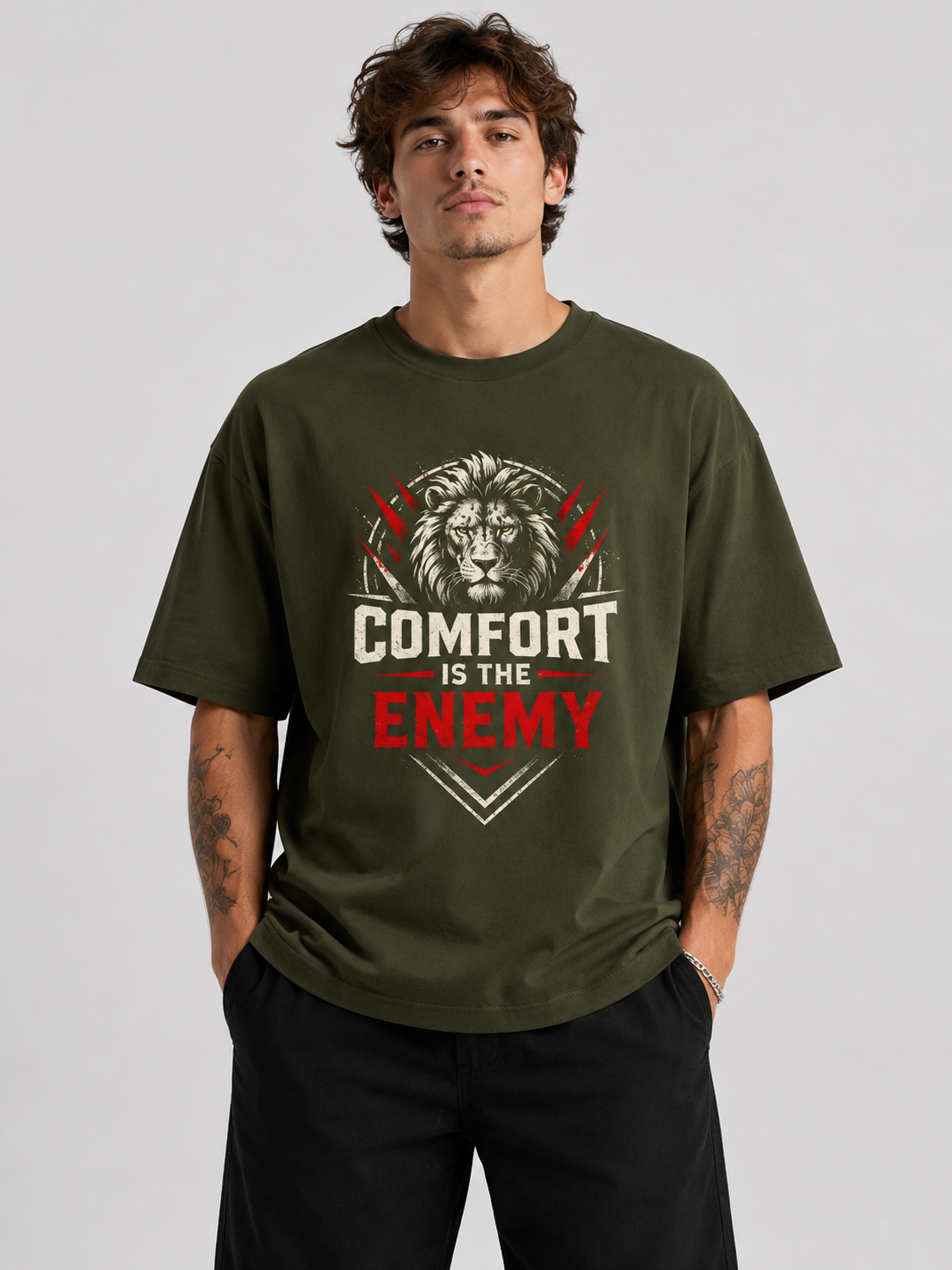 Person wearing a green t-shirt with a lion graphic and text on a gray background