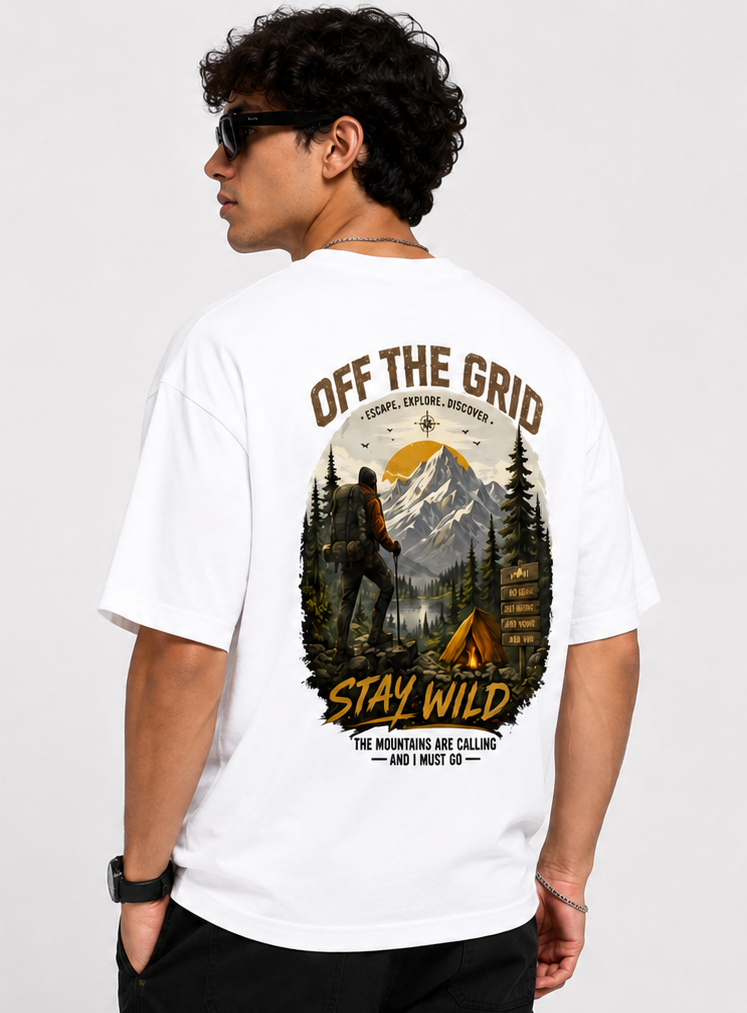 Person wearing a white t-shirt with outdoor-themed design and text.