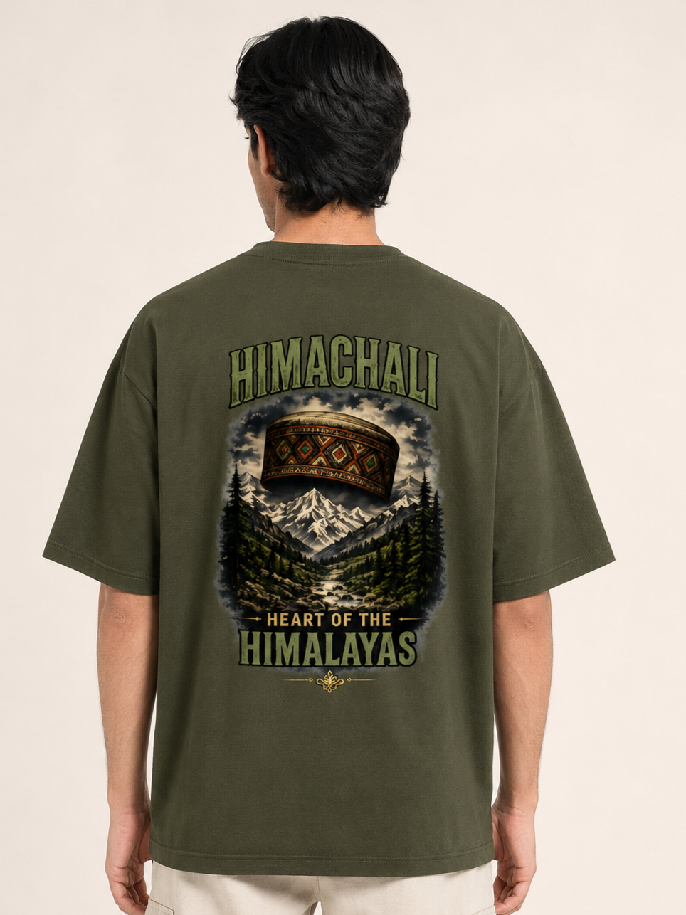 Person wearing a green t-shirt with 'Himachali Heart of the Himalayas' design on the back.