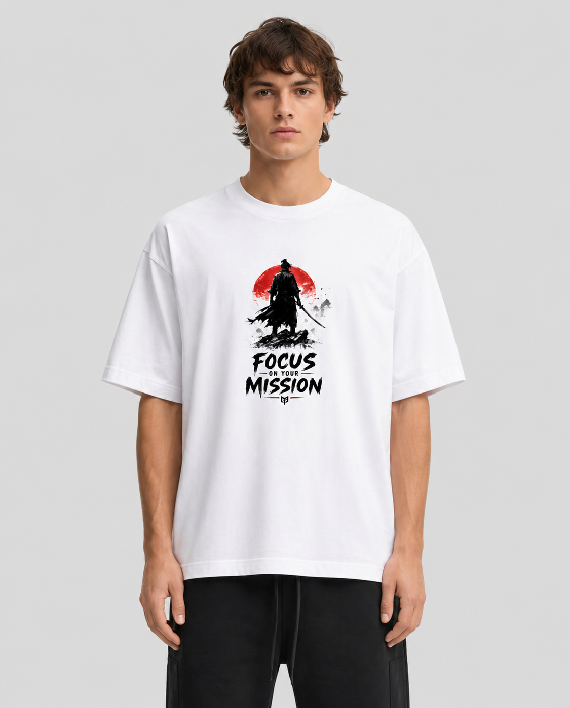 Person wearing a white t-shirt with a graphic design and text on a plain background
