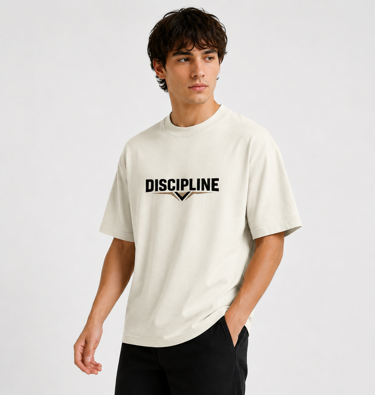 Person wearing a beige t-shirt with 'DISCIPLINE' text on a plain background