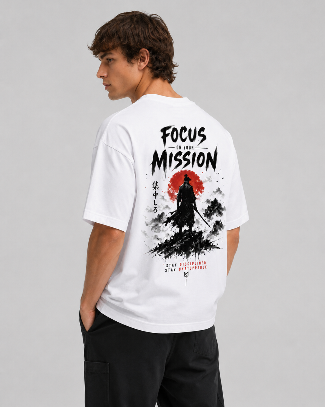 Person wearing a white t-shirt with a graphic design and text on the back, standing against a plain background.